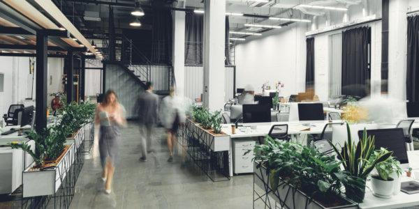 modern open space office interior with blurred business colleagues